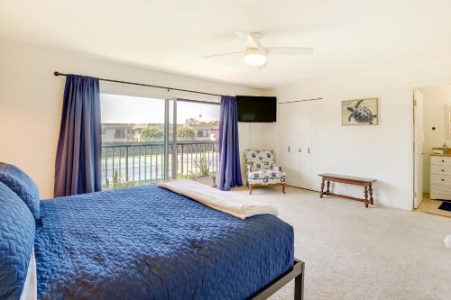 a bedroom with a blue bed and a balcony at Solana Beach Condo with 4 Pools and Beach Access! in Solana Beach