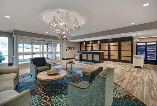 a living room with couches and a table at Homewood Suites by Hilton Hamilton, NJ in Hamilton