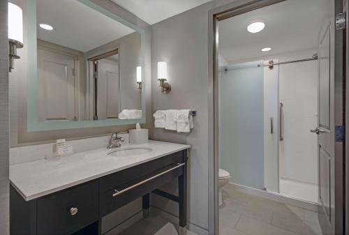 a bathroom with a sink and a shower at Homewood Suites by Hilton Hamilton, NJ in Hamilton
