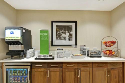 a coffee shop with a counter with a coffee machine at Hampton Inn & Suites Tucson Marana in Marana