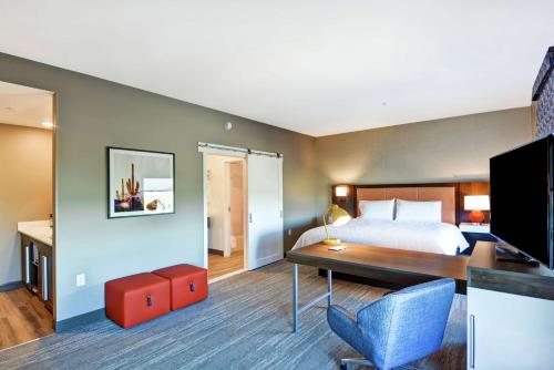 a hotel room with a bed and a desk at Hampton Inn & Suites Tucson Marana in Marana