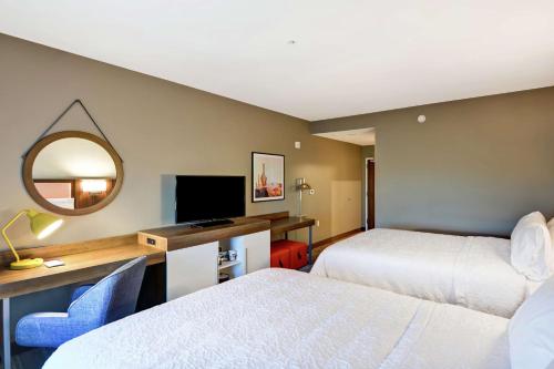 a hotel room with two beds and a mirror at Hampton Inn & Suites Tucson Marana in Marana