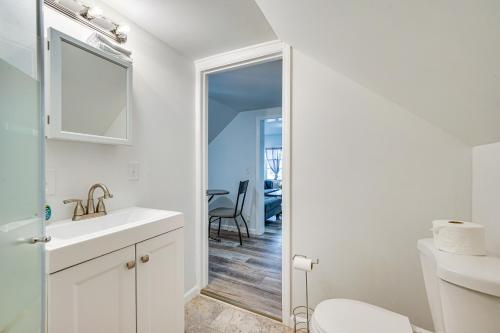 a white bathroom with a sink and a toilet at Cozy Glens Falls Getaway Less Than 1 Mi to Downtown in Glens Falls