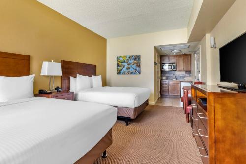 a hotel room with two beds and a flat screen tv at Hilton Vacation Club Lake Tahoe Resort South in South Lake Tahoe