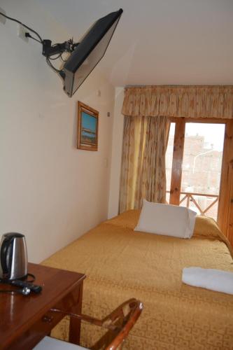 Postel nebo postele na pokoji v ubytování Hotel Los Flamencos