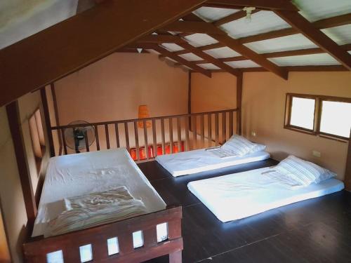 A bed or beds in a room at Antipolo Cabin Getaway