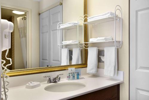 a bathroom with a sink and a mirror at Hampton Inn & Suites Providence-Warwick Airport in Warwick