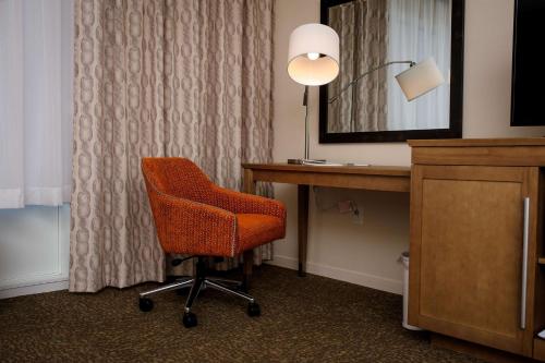 a desk and a chair in a hotel room at Hampton Inn & Suites Truro, NS in Truro