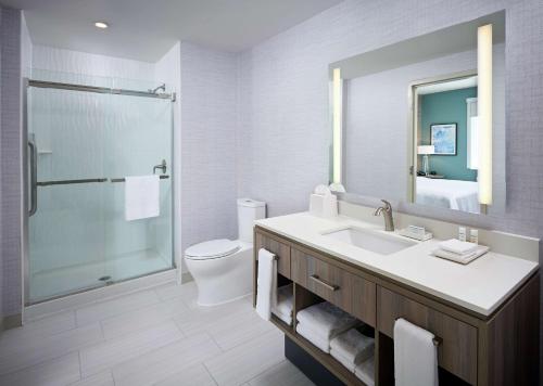 a bathroom with a sink and a shower and a toilet at Home2 Suites By Hilton Brantford in Brantford
