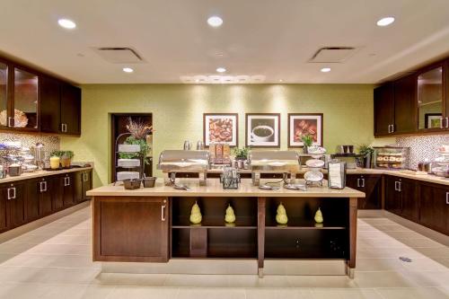 a large kitchen with a large island in the middle at Homewood Suites by Hilton Waterloo/St. Jacobs in Waterloo