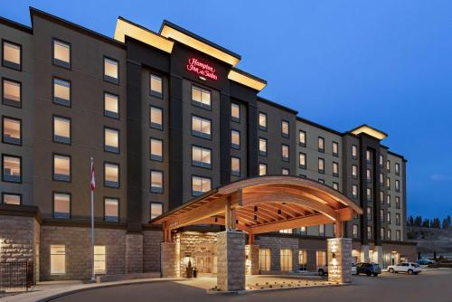 a hotel building with a gazebo in front of it at Hampton Inn & Suites Kelowna, British Columbia, Canada in Kelowna