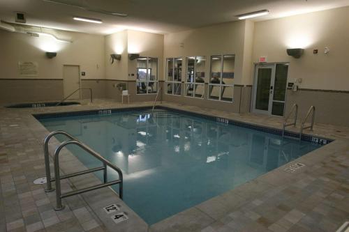 a large swimming pool in a building at Hampton Inn & Suites Red Deer in Red Deer