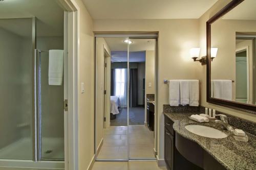 a bathroom with a sink and a shower at Homewood Suites by Hilton Sudbury in Sudbury