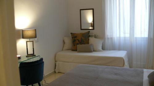 a small bedroom with two beds and a window at Camera Con Vista in Rome
