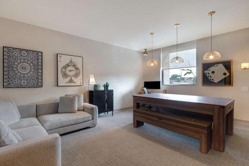 a living room with a couch and a table at Home2 Suites By Hilton Montreal Dorval in Dorval