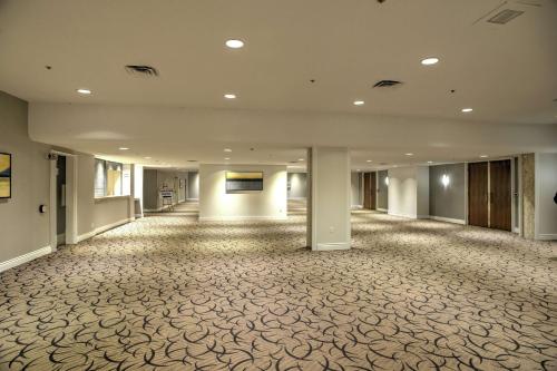 an empty lobby of a building with a large room at Doubletree by Hilton London in London