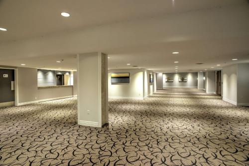 an empty hallway of a hotel with a large room at Doubletree by Hilton London in London