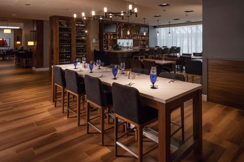 a dining room with a long table and chairs at Doubletree by Hilton London in London