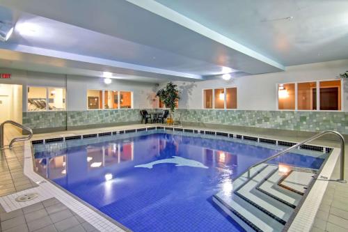 a large swimming pool in a hotel at Hampton Inn & Suites by Hilton Calgary-Airport in Calgary