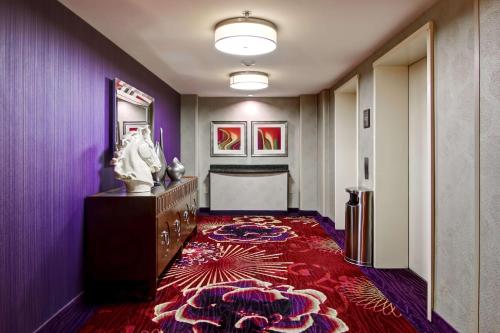 a room with purple walls and a red carpet at Hilton Garden Inn Toronto/Markham in Thornhill