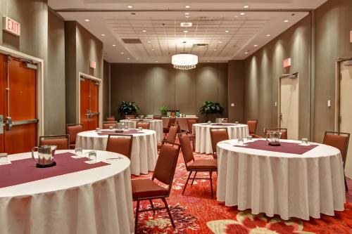 a conference room with round tables and chairs in it at Hilton Garden Inn Toronto/Markham in Thornhill