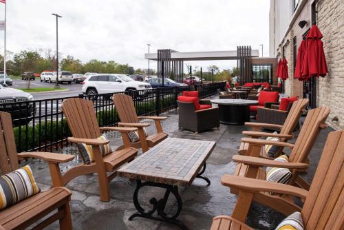 a group of chairs and tables on a patio at Hilton Garden Inn Gallatin in Gallatin