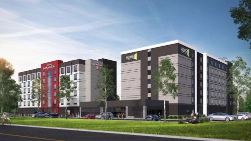a rendering of a building with cars in a parking lot at Hilton Garden Inn Toronto/Brampton West, Ontario, Canada in Brampton