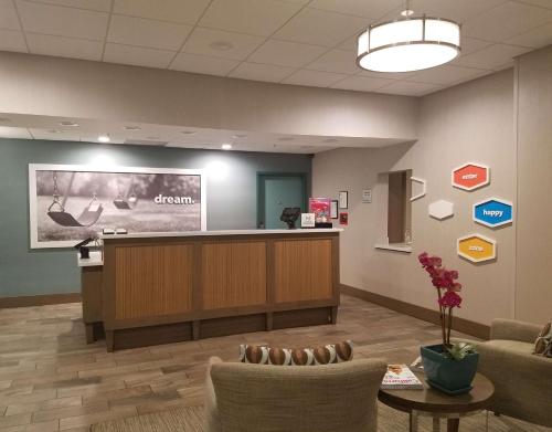 a waiting room at a dental office with a reception desk at Hampton Inn Channel Islands Harbor in Oxnard