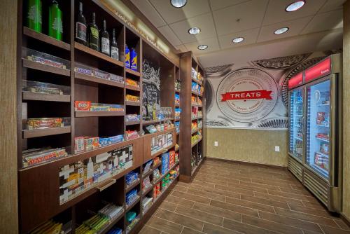 a grocery store aisle with shelves of food and drinks at Hampton Inn & Suites Hood River in Hood River