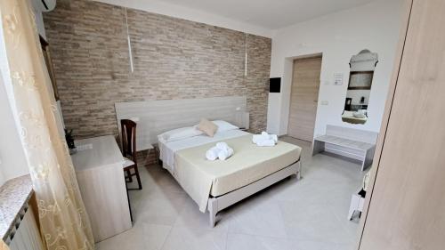 Postel nebo postele na pokoji v ubytování Hera Tropea Rooms