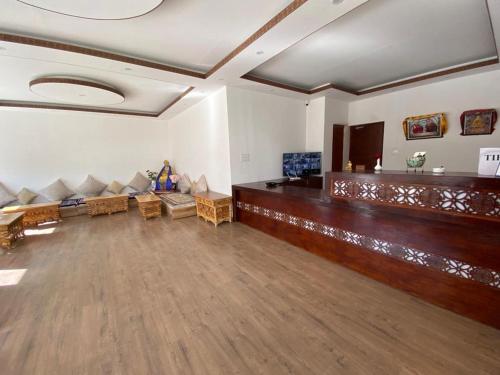 a large living room with couches and a large at Lha-Zes in Leh