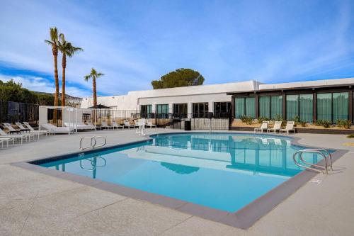 a swimming pool in front of a building at Doubletree By Hilton Palmdale, Ca in Palmdale