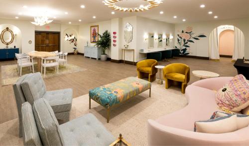 a living room with a lot of chairs and tables at Estancia del Norte San Antonio, A Tapestry Hotel by Hilton in San Antonio