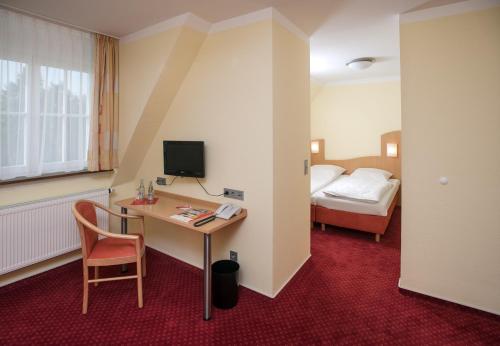 Postel nebo postele na pokoji v ubytování Johanniterhotel