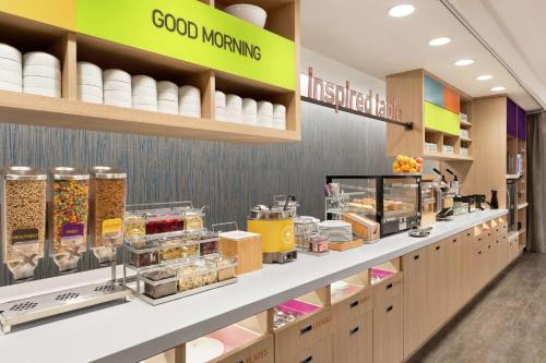 a bakery counter with food items on display at Home2 Suites By Hilton Harrisburg Hershey in Harrisburg