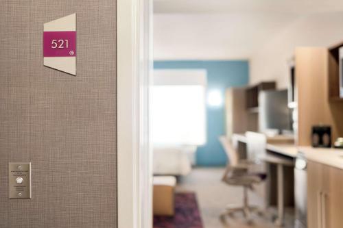 an open door to an office with a room at Home2 Suites By Hilton Harrisburg Hershey in Harrisburg
