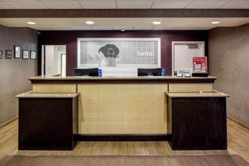 a lobby of a hotel with a reception counter at Hampton Inn & Suites Austin Cedar Park-Lakeline in Austin