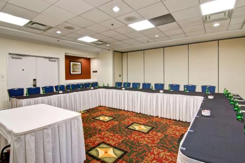 a conference room with a long table and chairs at Hilton Garden Inn Toronto/Mississauga in Mississauga
