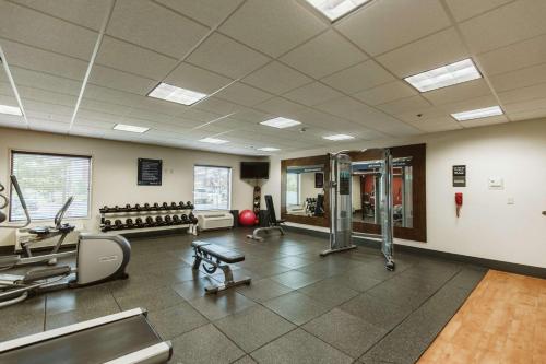 a gym with treadmills and machines in a room at Hampton Inn Bismarck in Bismarck
