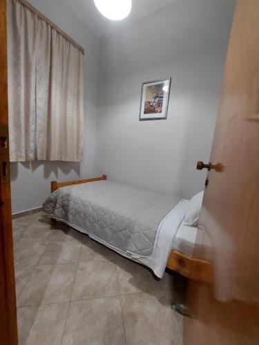 Postel nebo postele na pokoji v ubytování Zagas Hotel Ξενοδοχειο Ζάγκας