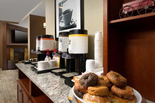 a plate of pastries on a counter in a room at Hampton Inn Rochester Greece in Rochester