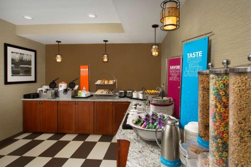 a restaurant kitchen with a counter with a buffet at Hampton Inn Rochester Greece in Rochester