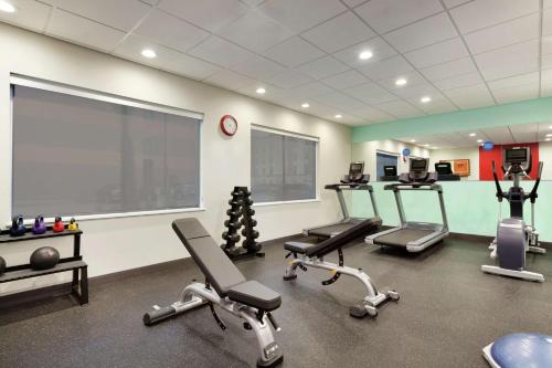 a gym with several cardio machines in a room at Tru By Hilton Lake Charles in Lake Charles