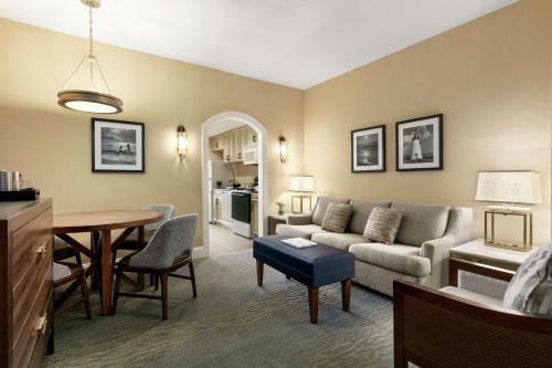 a living room with a couch and a table at Hilton Suites Ocean City Oceanfront in Ocean City