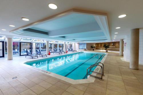 a large swimming pool in a hotel lobby at Hilton Suites Toronto-Markham Conference Centre & Spa in Markham