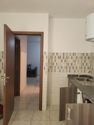 a kitchen with a sink and a counter top at complexe doha marjane tetouan in Tétouan
