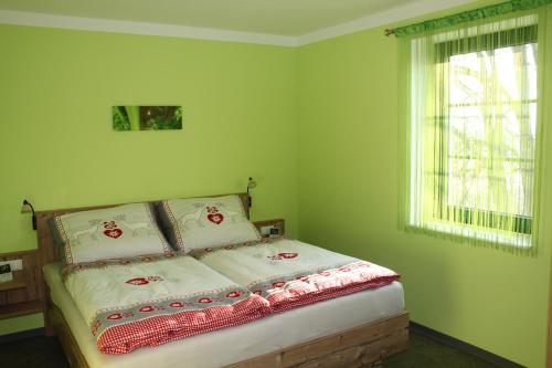 
Ein Bett oder Betten in einem Zimmer der Unterkunft Weingut Lachinger - Ferienwohnung Traumgut
