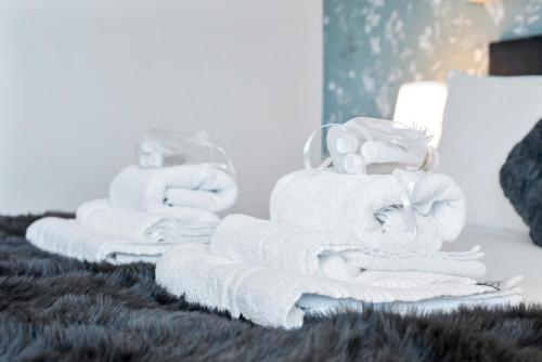 a pile of towels sitting on a table at Stunning Flat on King's Road, Chelsea with Balcony in London