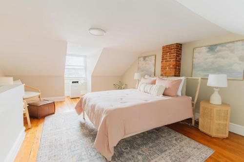 a bedroom with a bed and a brick wall at Quaint Boho Home in Lancaster City in Lancaster