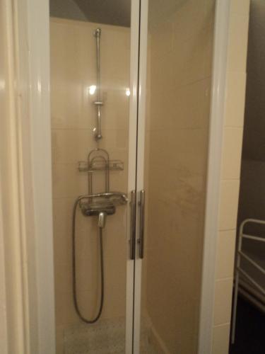 a shower in a bathroom with a glass door at ferme de séjour verchalles in Verchales-Soutro